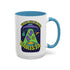 White ceramic coffee mug with a bright yellow handle and interior, featuring a printed alien abduction design with two purple cats, peace signs, and the phrase “Take Me to Your Barista” in green and purple text.